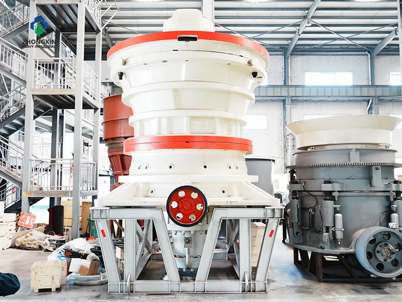 Heavy-duty gyratory crusher displayed in manufacturing workshop for large-scale mining and quarry applications