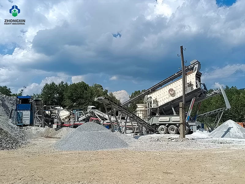 Mobile crushing plant working in mining for ore processing with conveyor