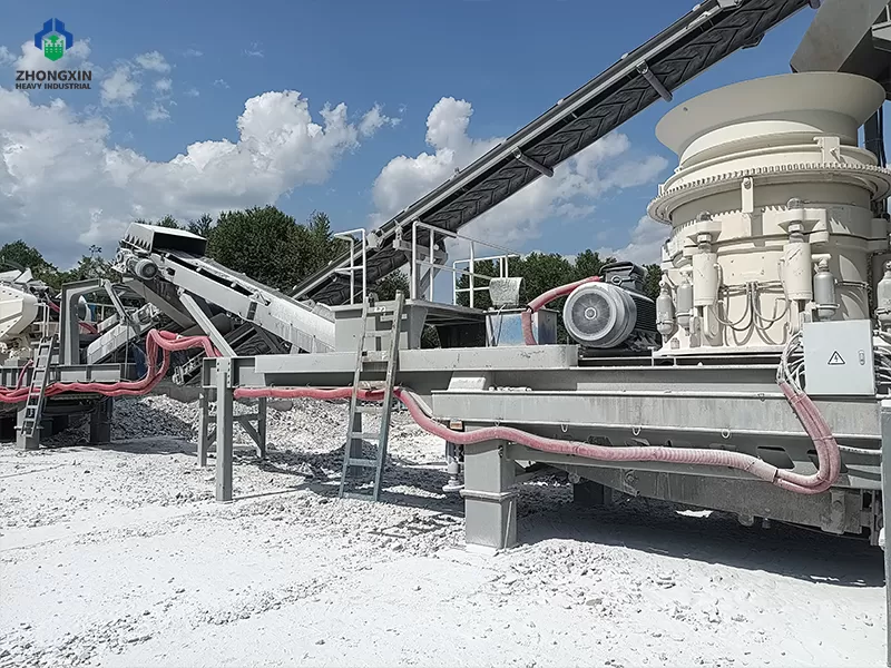 Mobile cone crusher crushing hard rock at quarry production site