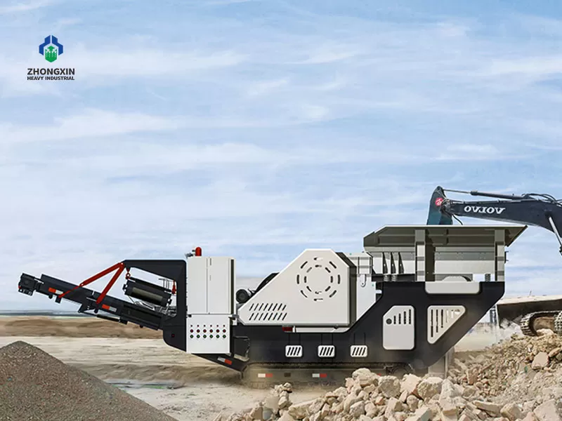 Crawler jaw crusher station crushing hard rock at quarry production site