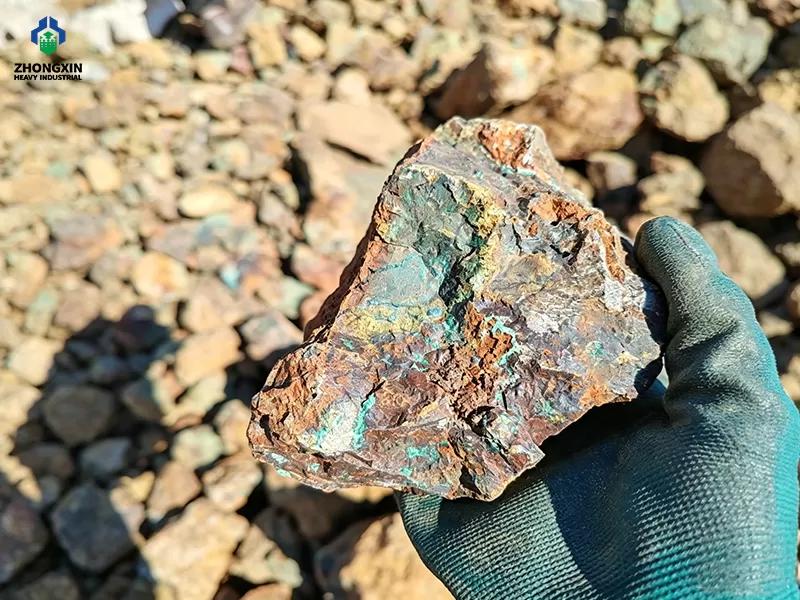Raw oxidized copper ore feed with malachite and azurite mineralization before crushing