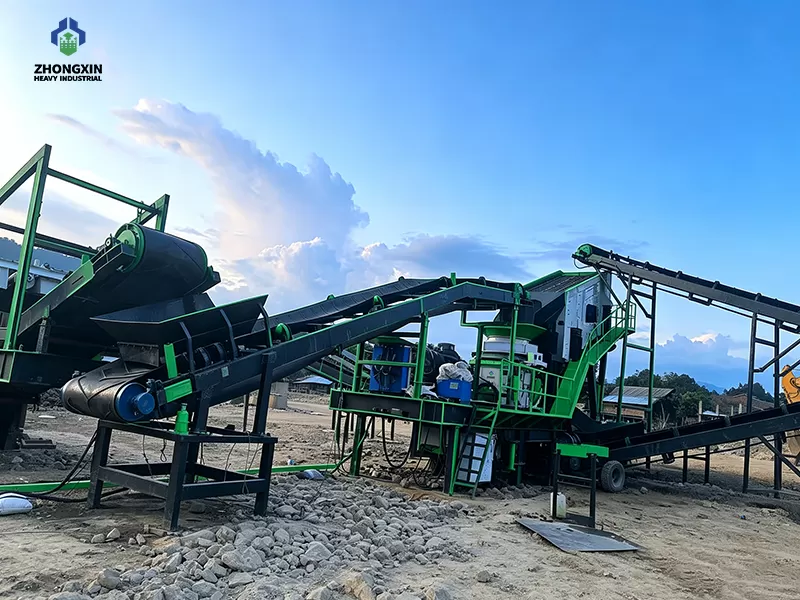 Wheel-mounted mobile crushing station deployed on-site for highway pavement base aggregate production
