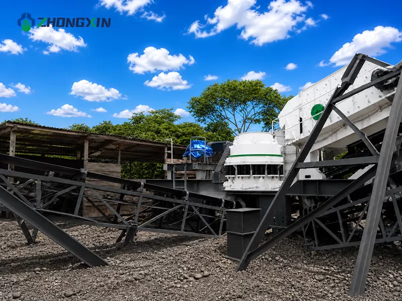 Track-mounted mobile crusher working smoothly on rugged terrain at an open-pit aggregate site