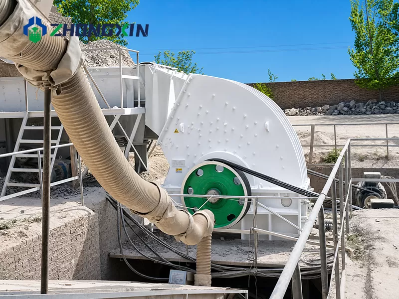 Heavy duty hammer crusher in operation at open-cast rock crushing and screening plant