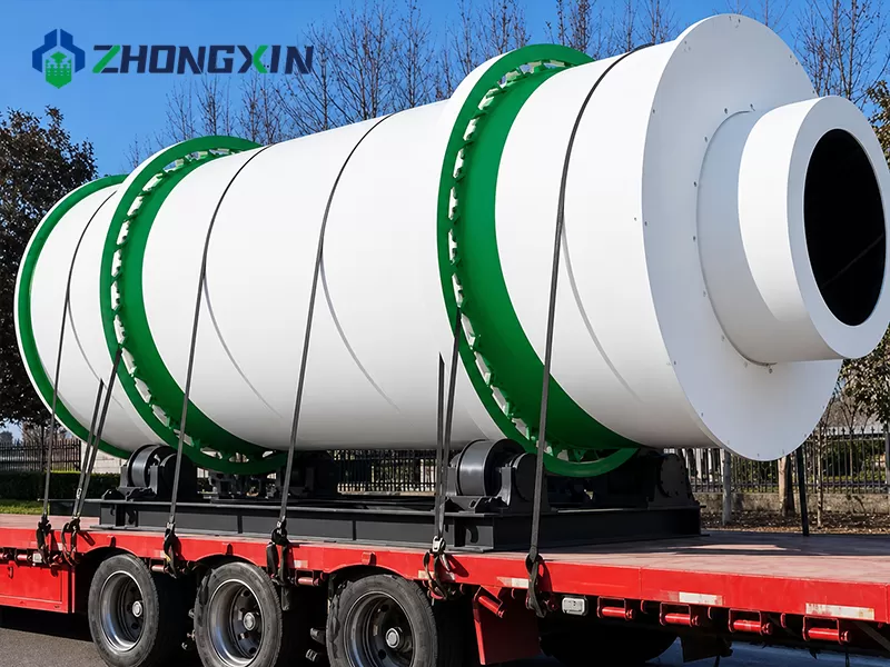 Three-cylinder dryer drum on a trailer under open sky