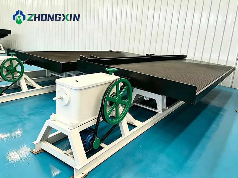 Gold shaking table side view showing drive mechanism and water supply system