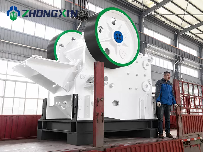 Lifting and assembly of primary European jaw crusher in manufacturing plant.