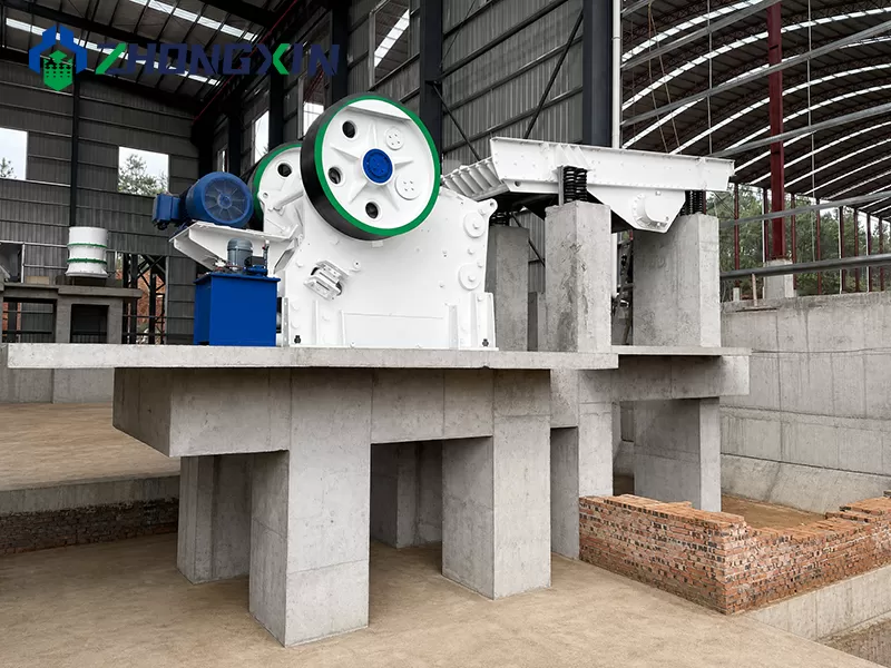Primary European jaw crusher unit with electric motor in stone processing plant.