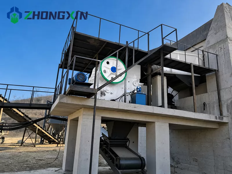European jaw crusher installed on concrete platform in primary crushing station.