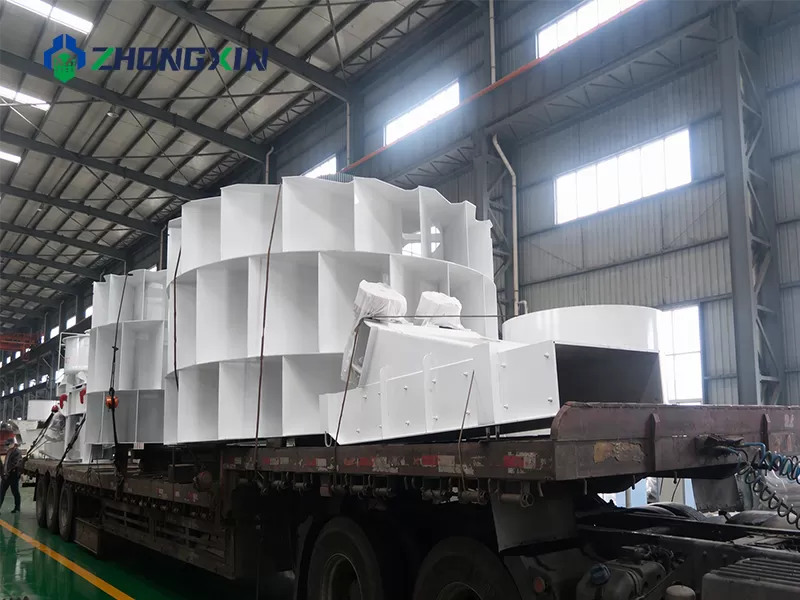 Loading a 120 TPH wheel sand washer into a container for international shipping.
