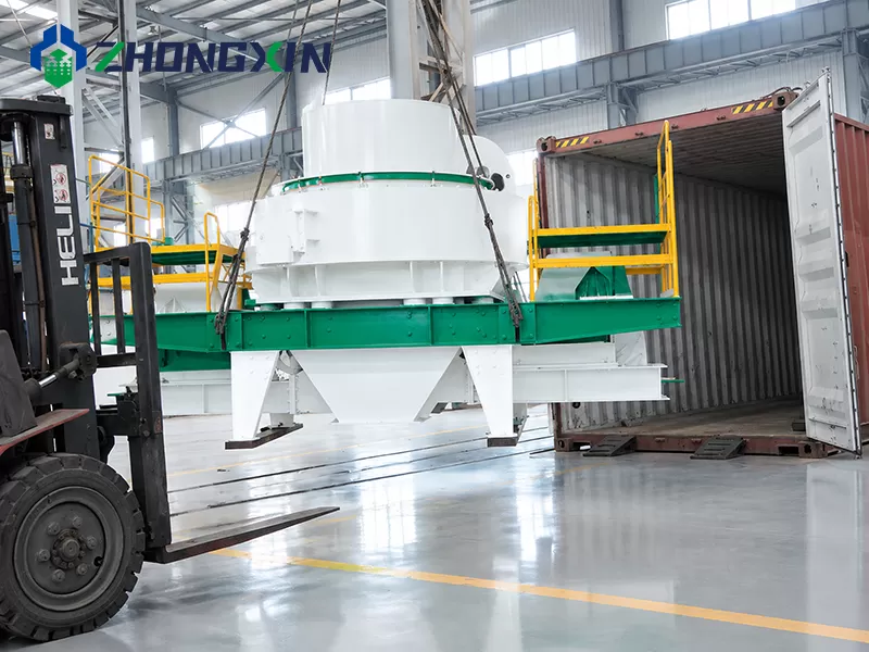 Forklift loading VSI sand making machine into sea container for export