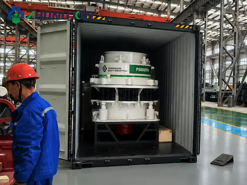 Export loading of heavy PSG Symons cone crusher machine at factory warehouse