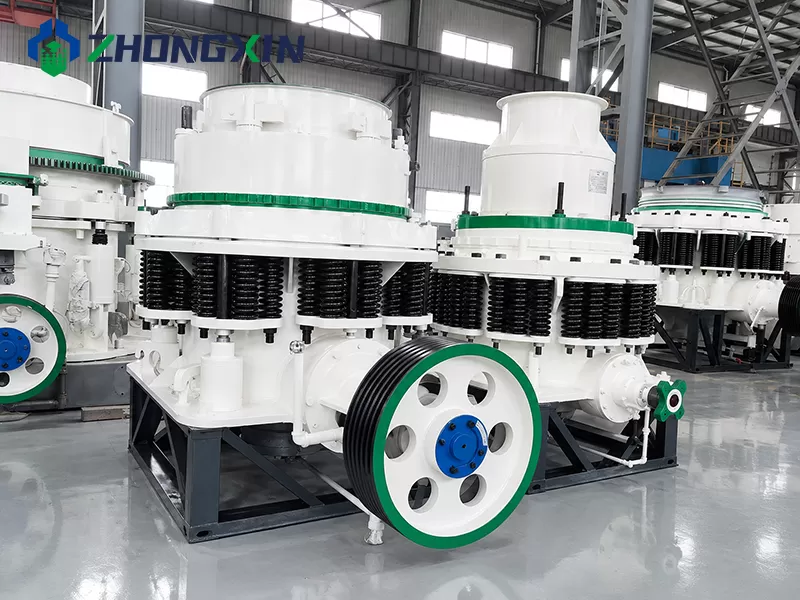 Heavy-duty PSG Symons cone crushers lined up in workshop stock at Zhongxin Heavy Industry
