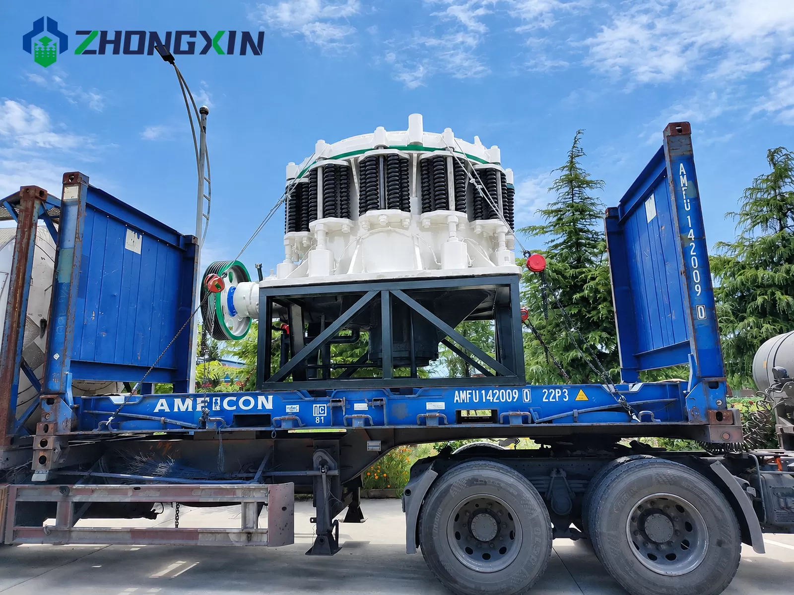 Flatbed trailer shipment of ZX compound cone crusher by Zhongxin Heavy Industry